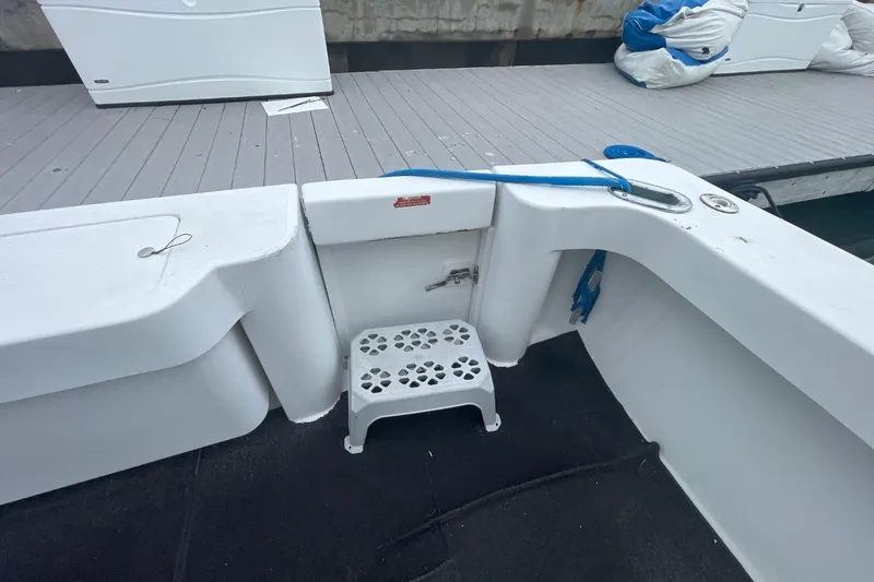 Slide: The Image of 1997 Luhrs 36 SX boat deck with step stool and dock view. - 35