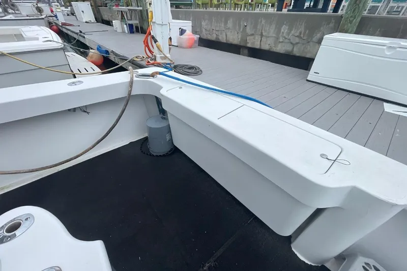 Slide: The Image of 1997 Luhrs 36 SX boat deck with dockside view and mooring equipment. - 36