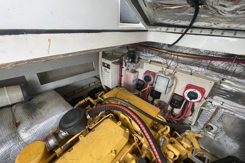 Slide: The Image of Engine room of 1997 Luhrs 36 SX boat with visible machinery and wiring. - 40