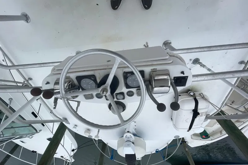 Slide: The Image of Overhead view of 1997 Luhrs 36 SX boat helm with steering wheel and controls. - 45