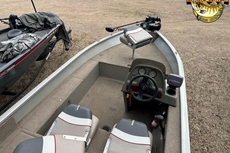 Slide: The Image of 2003 Tracker Pro Angler V 16 boat interior with steering console and seating. - 7