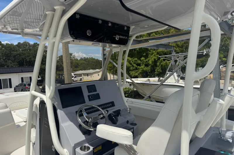 Slide: The Image of 2025 Key West 263 FS boat interior with modern helm and seating. - 10
