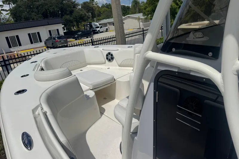Slide: The Image of 2025 Key West 263 FS boat interior with white seating and modern design. - 12