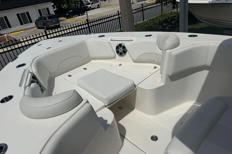 Slide: The Image of 2025 Key West 263 FS boat interior with white seating and speaker system. - 13