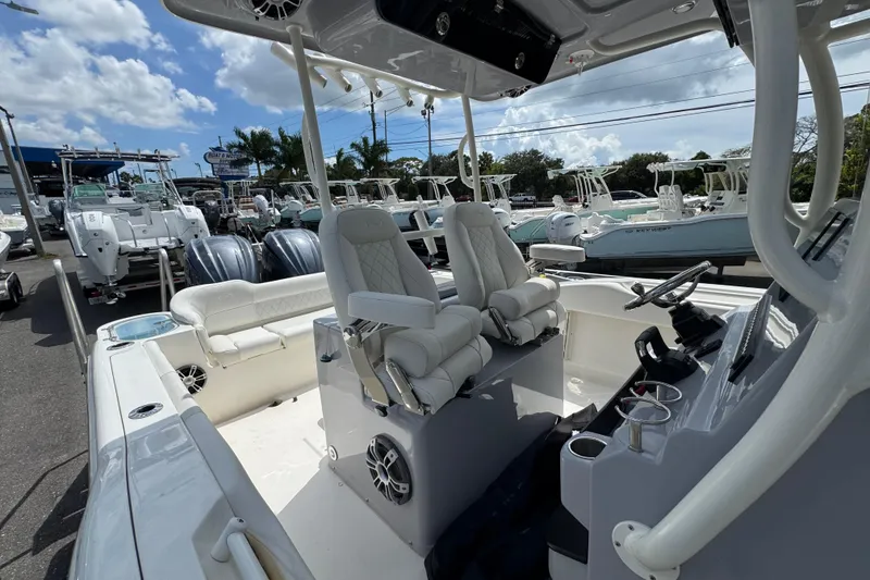 Slide: The Image of 2025 Key West 263 FS boat interior with dual seats and steering console. - 19