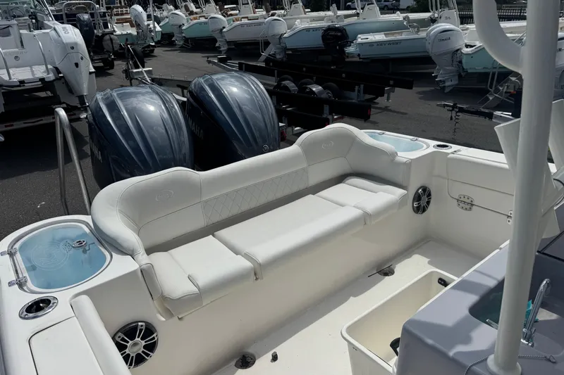 Slide: The Image of 2025 Key West 263 FS boat interior with seating and twin Yamaha engines. - 21
