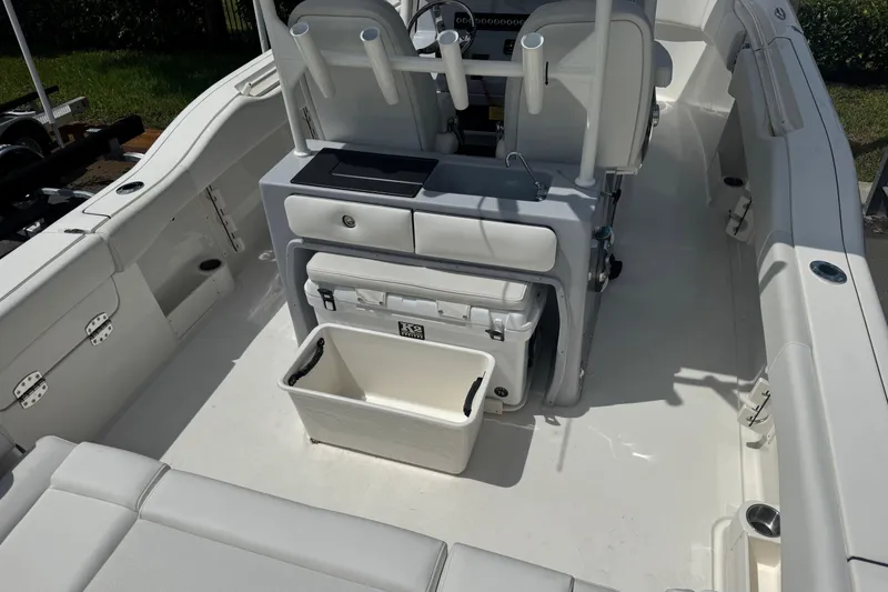 Slide: The Image of 2025 Key West 263 FS boat interior with seating and storage compartments. - 9