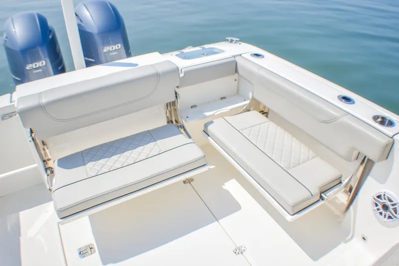 Slide: The Image of 2023 Pursuit DC 266 Dual Console boat with luxurious seating and twin engines. - 27