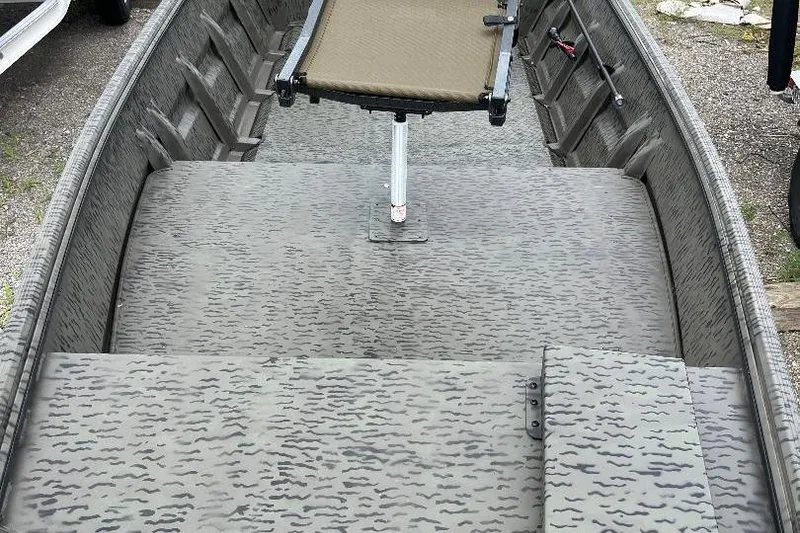 Slide: The Image of 2026 War Eagle 648LDV boat interior with camouflage pattern and adjustable seat. - 10