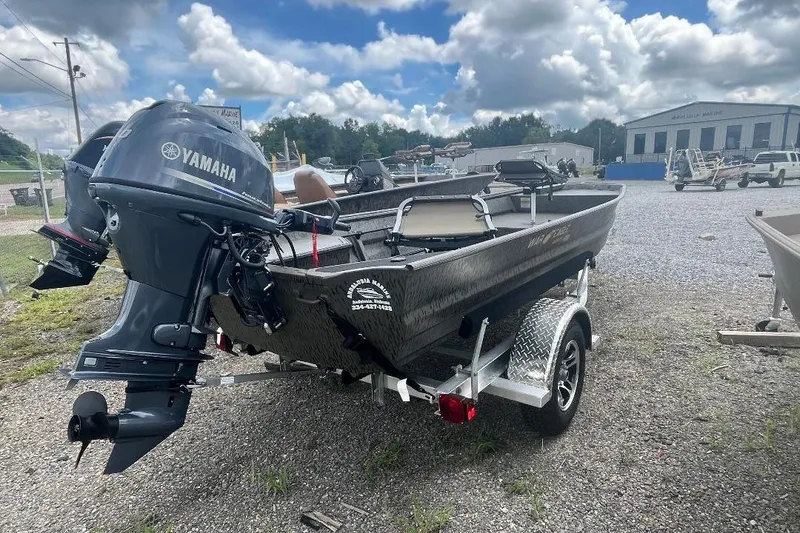 Slide: The Image of 2026 War Eagle 648LDV boat with Yamaha motor on trailer, outdoor setting. - 7