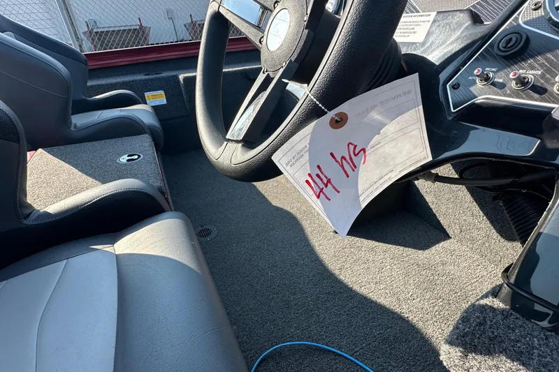 Slide: The Image of 2022 Lowe Stinger 188 boat interior with steering wheel and dashboard. - 11