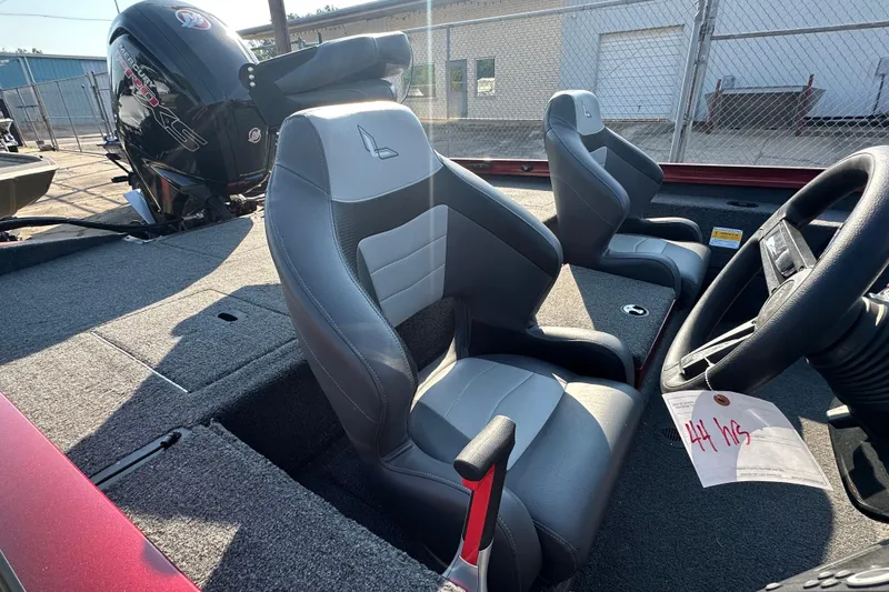 Slide: The Image of 2022 Lowe Stinger 188 boat interior with gray seats and steering wheel. - 14