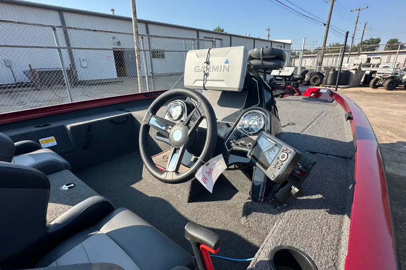 Slide: The Image of 2022 Lowe Stinger 188 boat interior with Garmin navigation system and steering wheel. - 9