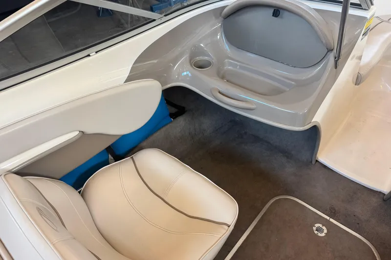 Slide: The Image of Interior of 2002 Maxum 1800 SR boat with beige seating and carpeted floor. - 11
