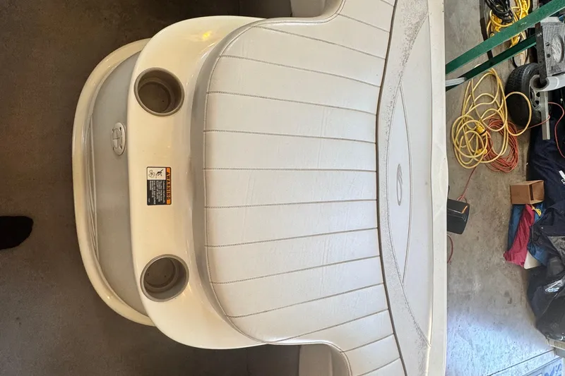 Slide: The Image of 2002 Maxum 1800 SR boat seat with cup holders in a garage setting. - 20