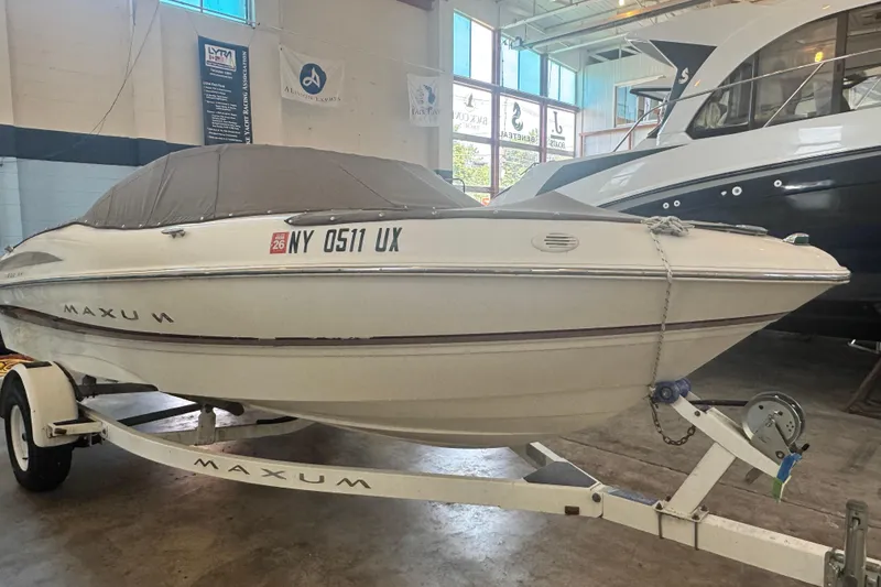 Slide: The Image of 2002 Maxum 1800 SR boat on trailer in indoor storage facility. - 23