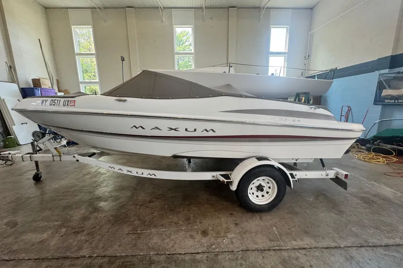 Slide: The Image of 2002 Maxum 1800 SR boat on trailer in indoor storage facility. - 4