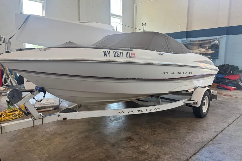 Slide: The Image of 2002 Maxum 1800 SR boat on trailer in indoor storage facility. - 5