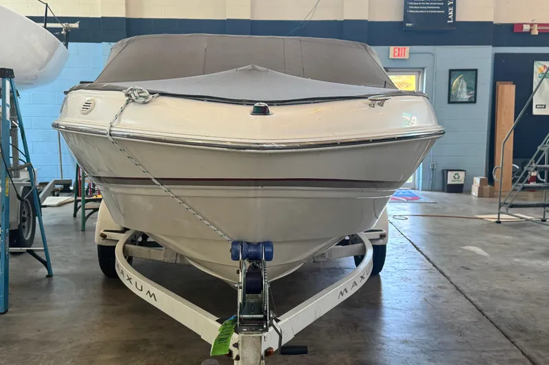 Slide: The Image of 2002 Maxum 1800 SR boat on trailer in indoor storage facility. - 6