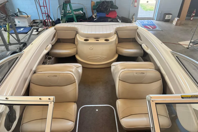 Slide: The Image of Interior of 2002 Maxum 1800 SR boat with beige seating and spacious layout. - 9
