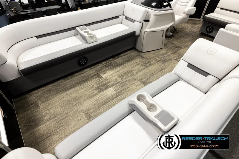 Slide: The Image of Luxurious interior of 2023 Godfrey SW2286C pontoon boat with plush seating and cup holders. - 10