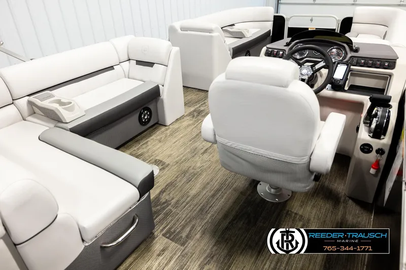 Slide: The Image of Interior of 2023 Godfrey SW2286C boat with modern seating and control panel. - 12