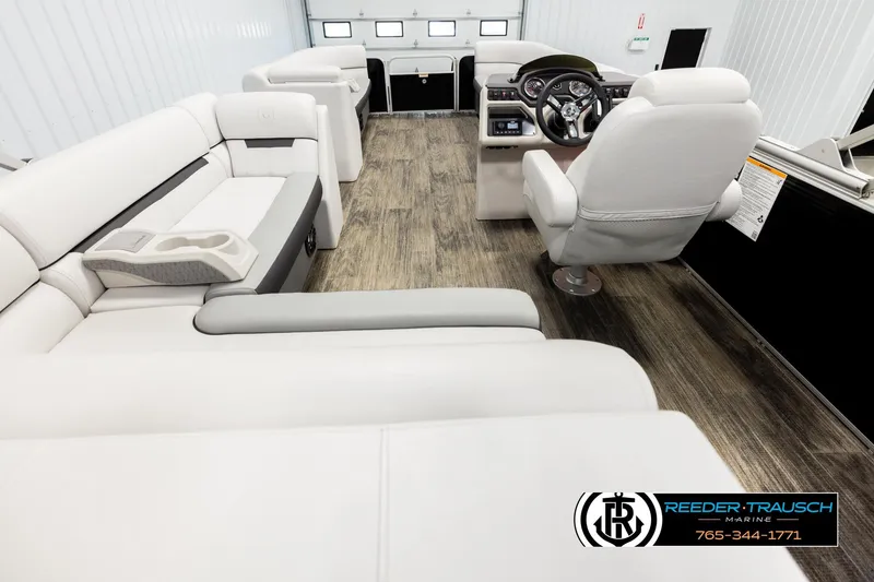 Slide: The Image of Luxurious interior of 2023 Godfrey SW2286C boat with plush seating and modern dashboard. - 16