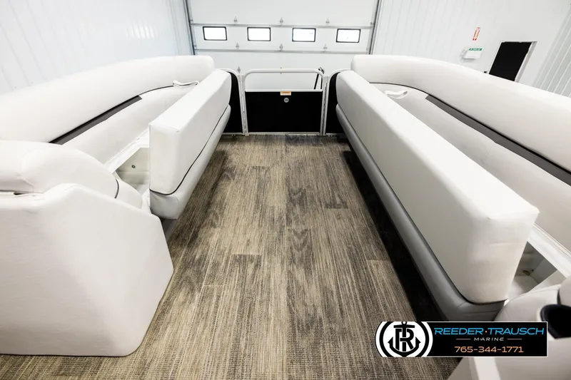 Slide: The Image of Interior of 2023 Godfrey SW2286C boat with white seating and wood-style flooring. - 20