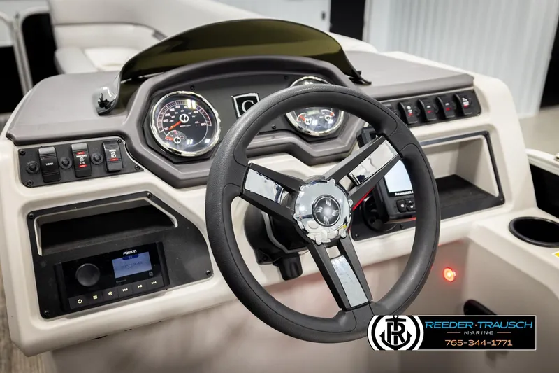 Slide: The Image of Steering console of 2023 Godfrey SW2286C boat with modern controls and gauges. - 27