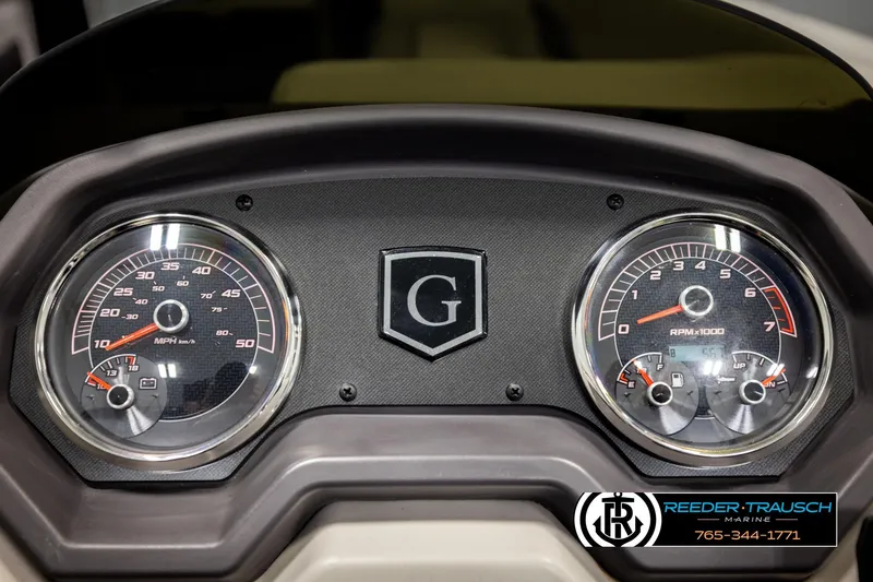 Slide: The Image of Dashboard of 2023 Godfrey SW2286C boat with speedometer and tachometer gauges. - 31