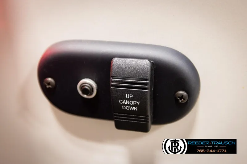Slide: The Image of 2023 Godfrey SW2286C canopy control switch with "Up" and "Down" options. - 38