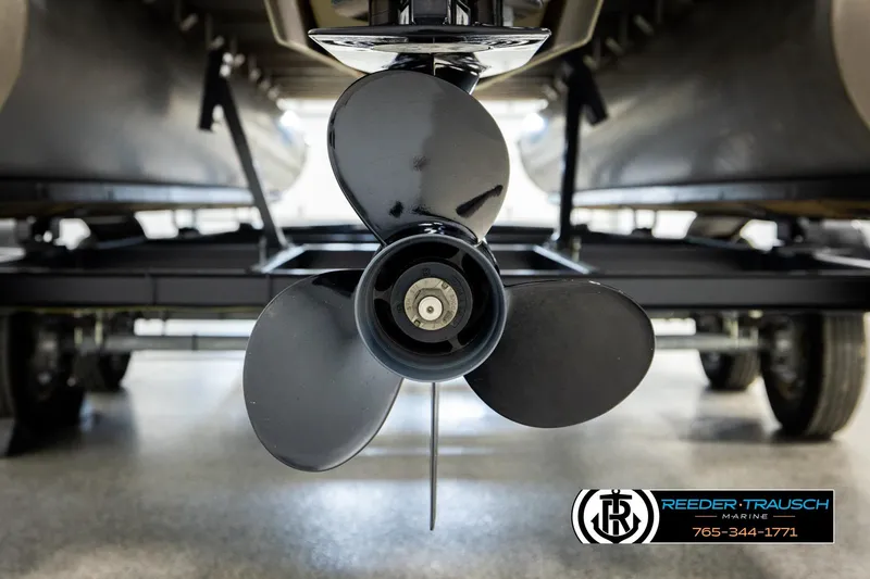 Slide: The Image of Close-up of a 2023 Godfrey SW2286C boat propeller in a showroom setting. - 47