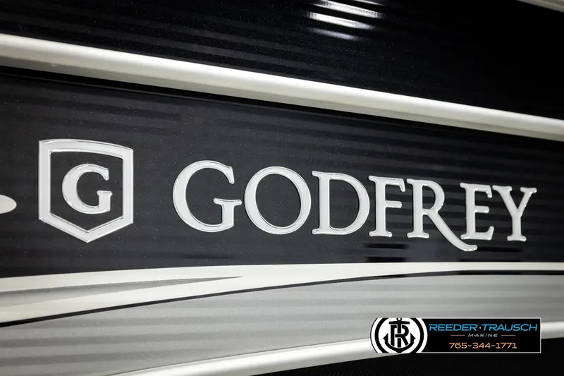 Slide: The Image of Godfrey SW2286C 2023 model logo on sleek black surface, Reeder-Trausch Marine branding. - 51
