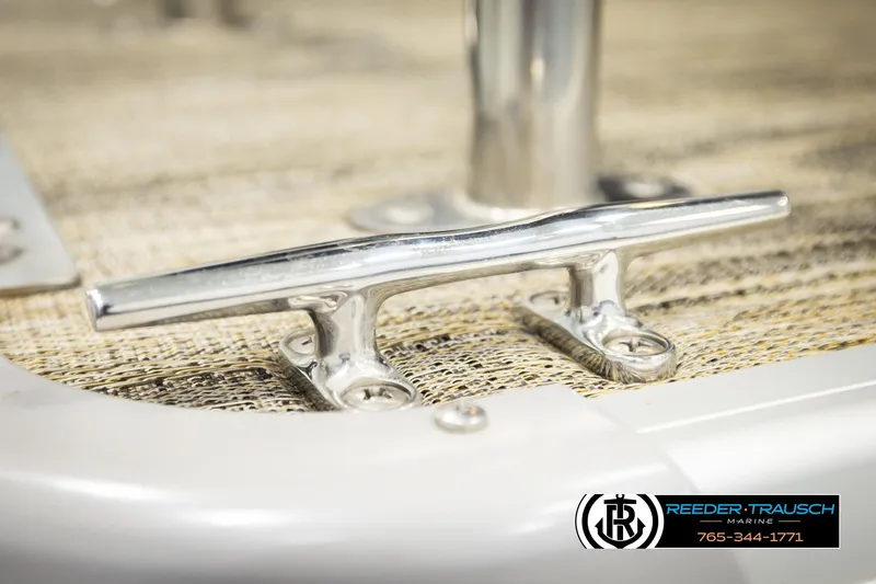 Slide: The Image of Close-up of a 2023 Godfrey SW2286C boat cleat on textured surface. - 52