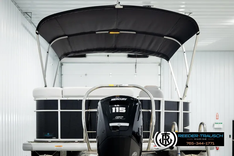 Slide: The Image of 2023 Godfrey SW2286C pontoon boat with Mercury 115 engine in showroom. - 7