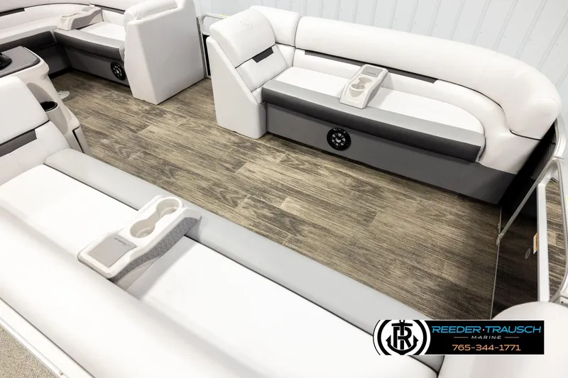 Slide: The Image of Luxurious 2023 Godfrey SW2286C boat interior with plush seating and cup holders. - 9