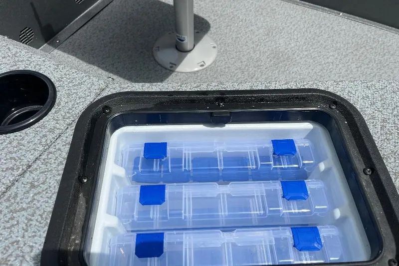 Slide: The Image of Storage compartment on 2026 War Eagle 754VS Stick Steer boat with tackle boxes. - 12