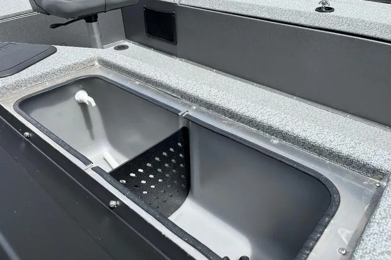 Slide: The Image of Interior view of 2026 War Eagle 754VS Stick Steer boat, featuring a built-in storage compartment. - 13