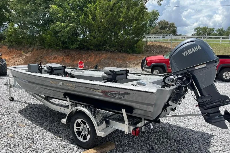 Slide: The Image of 2026 War Eagle 754VS Stick Steer boat with Yamaha motor on a trailer. - 2