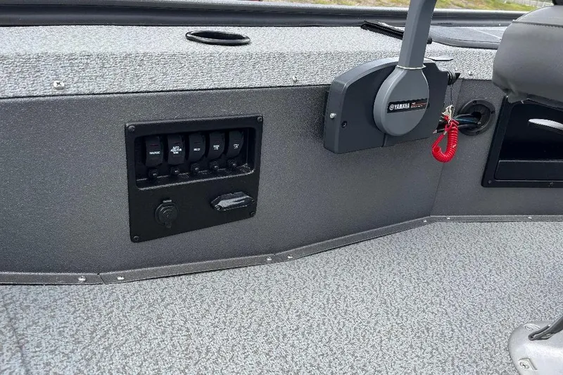 Slide: The Image of 2026 War Eagle 754VS Stick Steer boat dashboard with Yamaha controls and switch panel. - 8