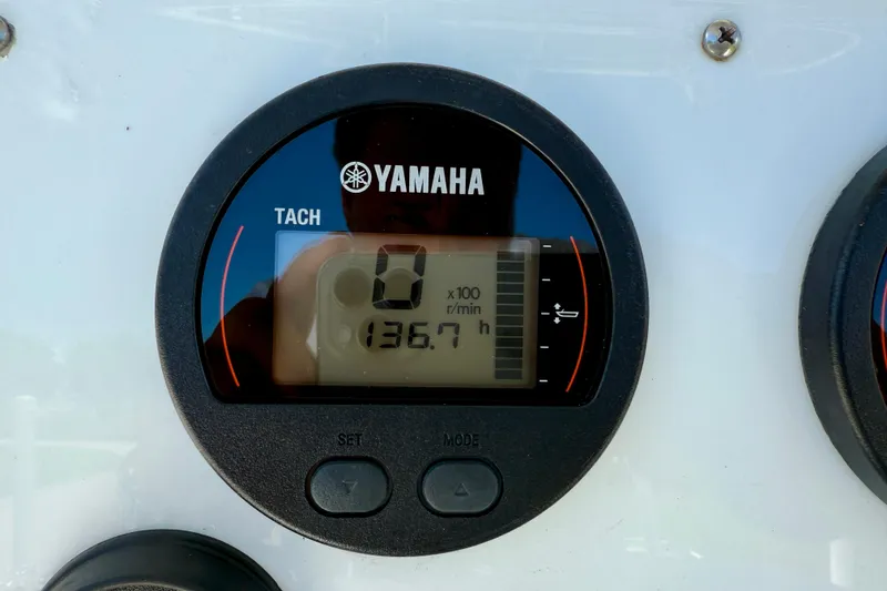 Slide: The Image of Yamaha tachometer on 2002 Sea Pro 220 Center Console, displaying 136.7 hours. - 12
