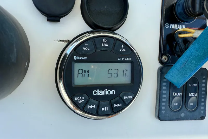 Slide: The Image of Clarion radio display on 2002 Sea Pro 220 Center Console boat dashboard. - 14