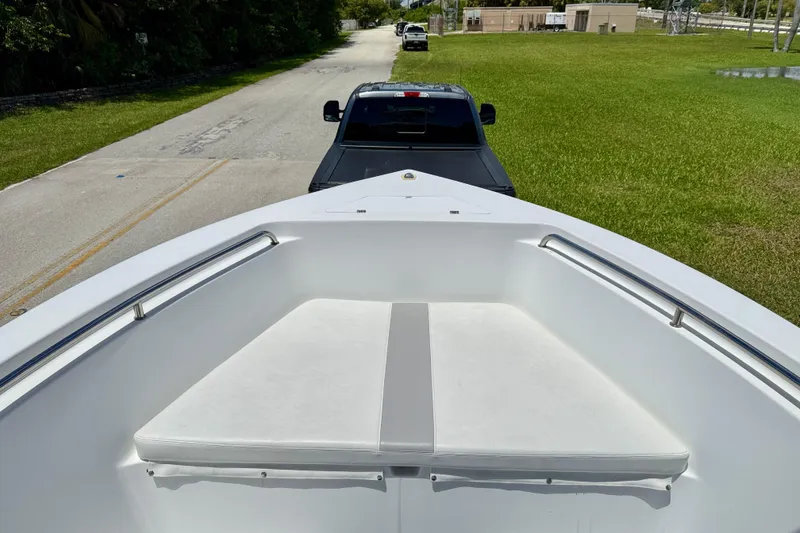 Slide: The Image of 2002 Sea Pro 220 Center Console boat on trailer, viewed from bow, parked on roadside. - 19