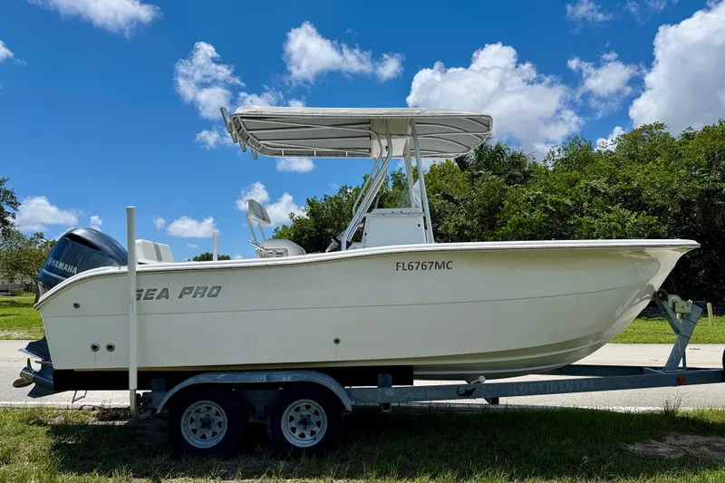 Slide: The Image of 2002 Sea Pro 220 Center Console boat on trailer under blue sky. - 2
