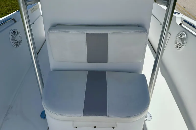 Slide: The Image of 2002 Sea Pro 220 Center Console boat seat with gray and white upholstery. - 21