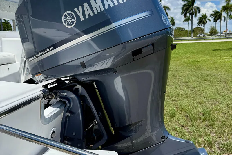 Slide: The Image of Yamaha four-stroke engine on 2002 Sea Pro 220 Center Console boat, outdoors. - 22