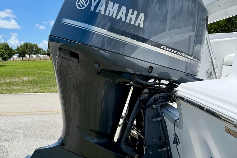 Slide: The Image of Yamaha four-stroke engine on 2002 Sea Pro 220 Center Console boat, outdoors. - 23