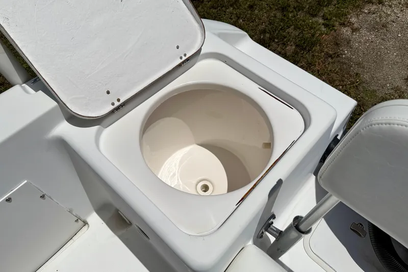 Slide: The Image of Open storage compartment on 2002 Sea Pro 220 Center Console boat. - 29