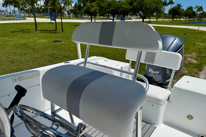 Slide: The Image of 2002 Sea Pro 220 Center Console boat with seating and outboard motor in a park setting. - 7