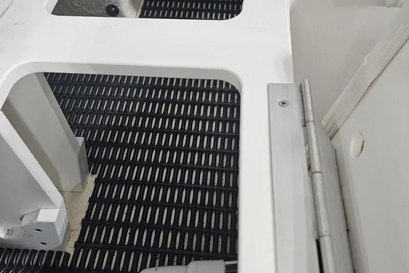 Slide: The Image of Interior view of 2020 Formula 330 Crossover Bowrider with black grid flooring. - 110